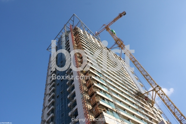 Crane and Skyscraper Building Under Construction
