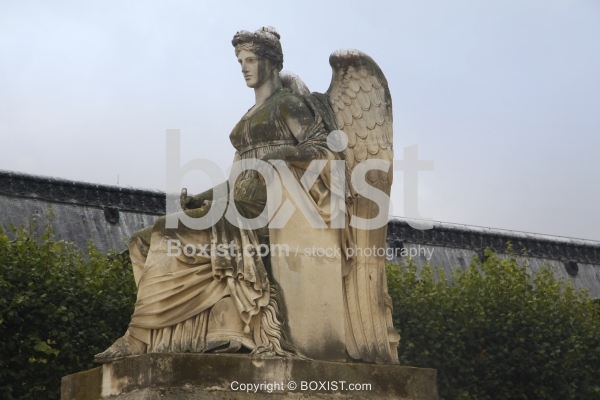 Angel with Wings Statue at Louvre Courtyard