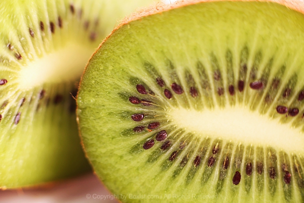 Closeup Of Single Whole Kiwi Fruit Cut In Half