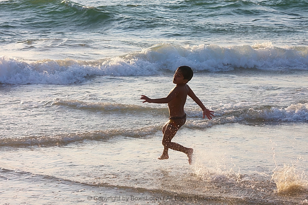 Boy Running Into The Sea