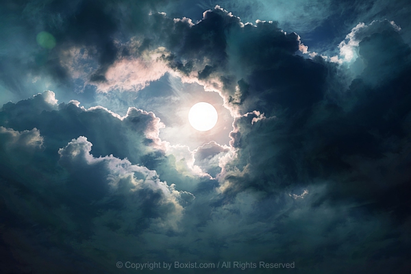 Cloudy Sky With The Sun Partially Obscured By Dark Swirling Clouds With Dark Shades