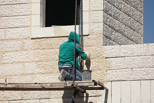 Construction Worker Cleaning Stones