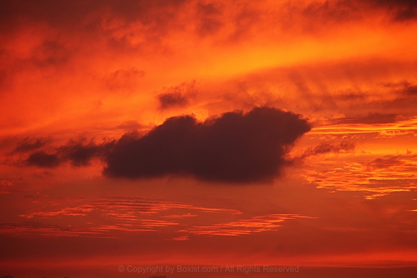 Dark And Beautiful Cloud In Red Sky At Sunset