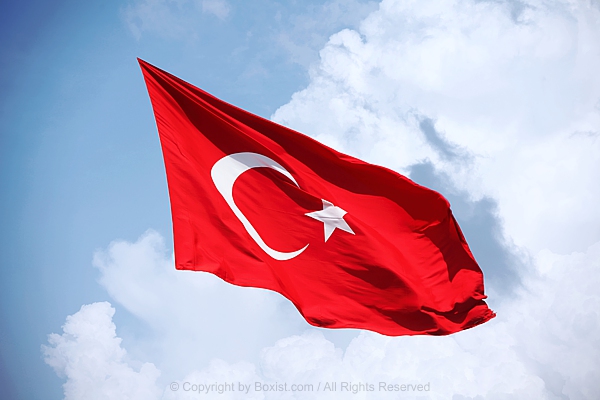 Turkish Flag Waving Against Blue Sky Background