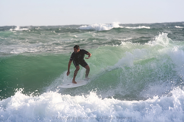 Man Surfing The Waves