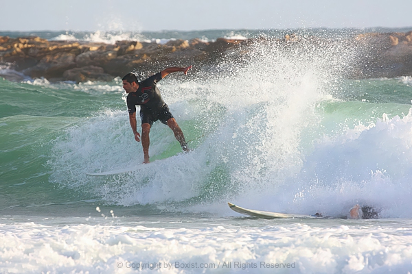 Thrilling Wave Ride By Passionate Young Surfer
