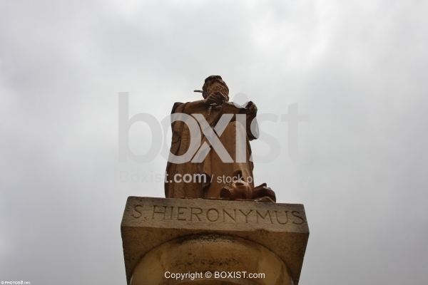 Saint Jerome Statue Against Cloudy Sky