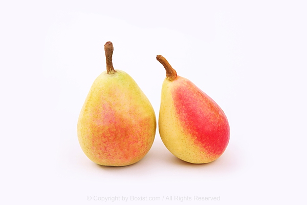 Two Ripe Pears Standing Side By Side Against White Background