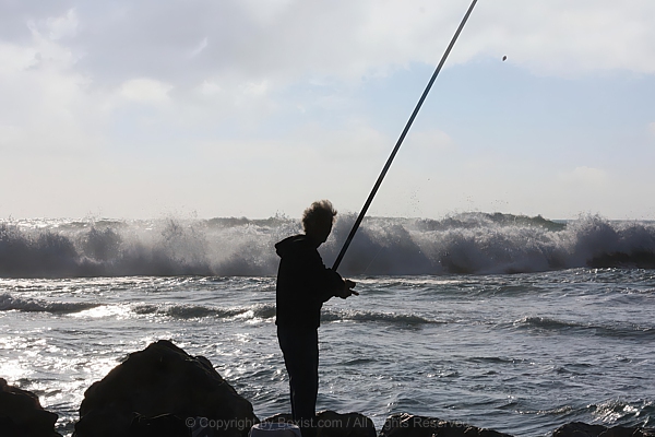 Dramatic Seascape With Fisherman Against Raging Sea