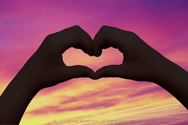 Child Hands Forming Love Heart At Sunset