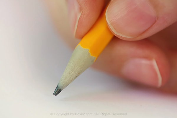 Hand Holding Yellow Pencil Ready For Writing
