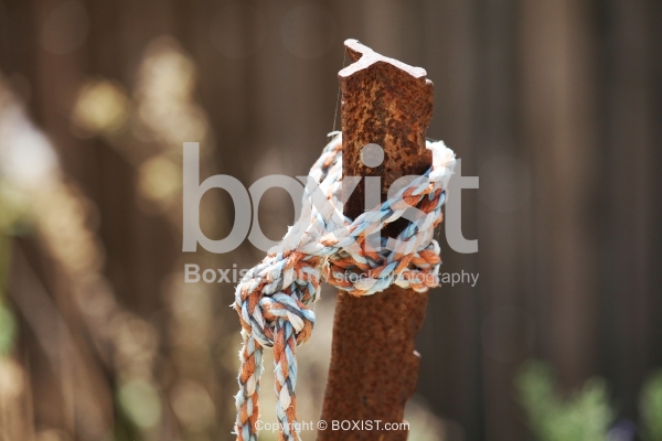 Rope Tied Into Rusty Metal