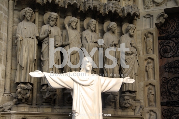 Jesus with Open Hands Against Gothic Sculpture