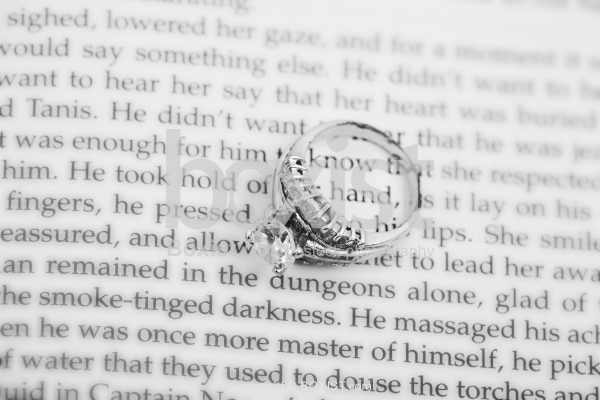 Silver Ring Over Book In Black and White