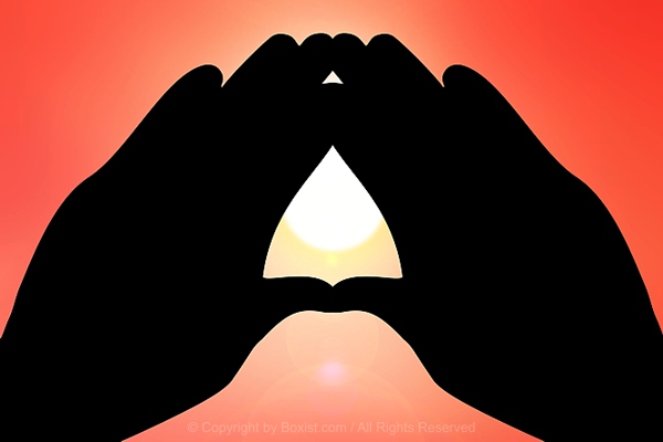Making Triangle With Two Hands At Sunset