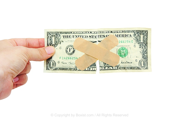 Hand Holding Torn One Dollar Bill Taped With Bandages