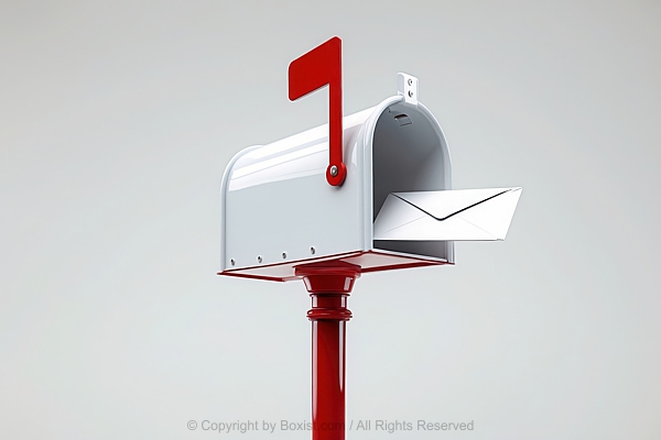 White Mailbox With White Envelope Mounted On Red Pole