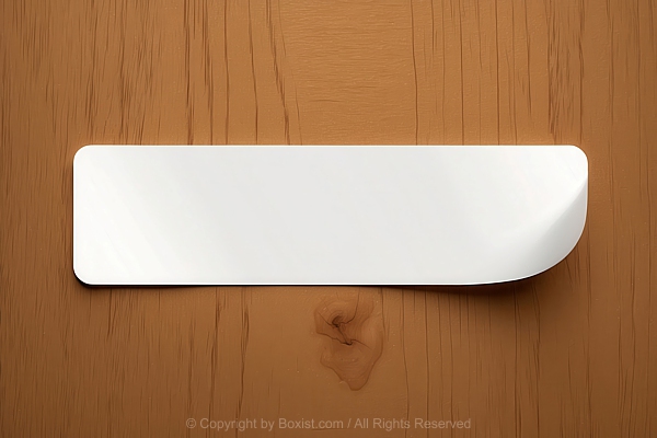 Rectangular White Sticker Or Label Placed On Wooden Surface