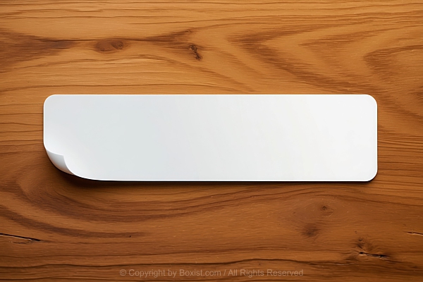 Rectangular White Blank Sticker Label Placed On Bright Wooden Surface