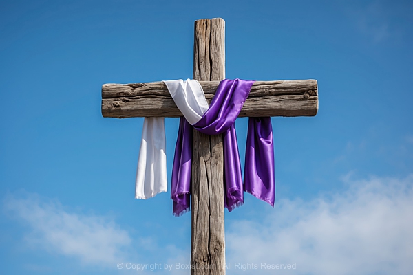 Wooden Cross With Draped Purple And White Cloth Against Blue Sky Background