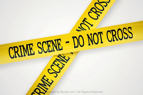 Two Intersecting Strips Of Yellow Crime Scene Tape Against White Background