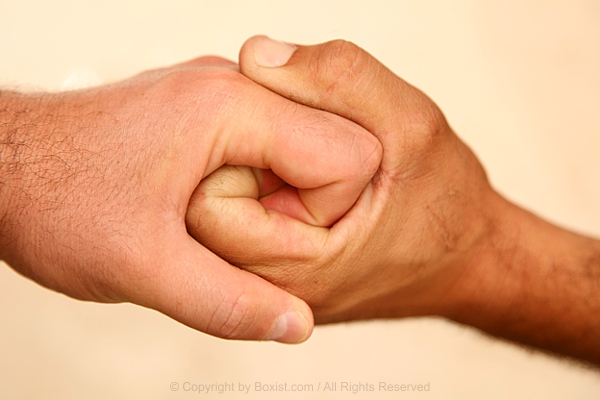 Two Hands Clenched Together
