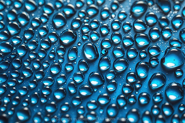 Macro Of Small Blue Water Droplets On Smooth Surface