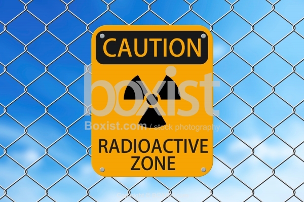 Caution Radioactive Zone Sign On Fence