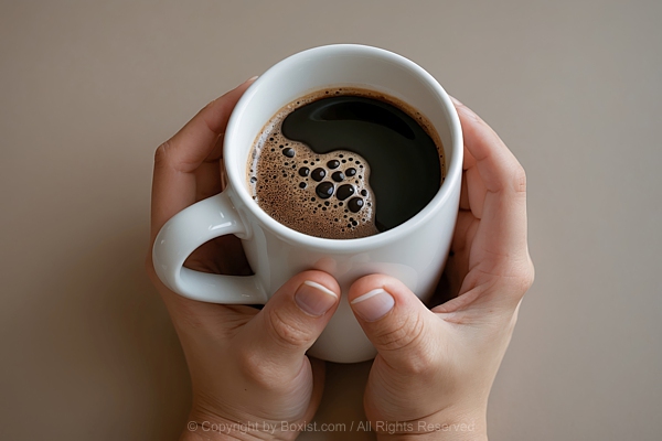 Person Hands Cradle Cup Of Coffee