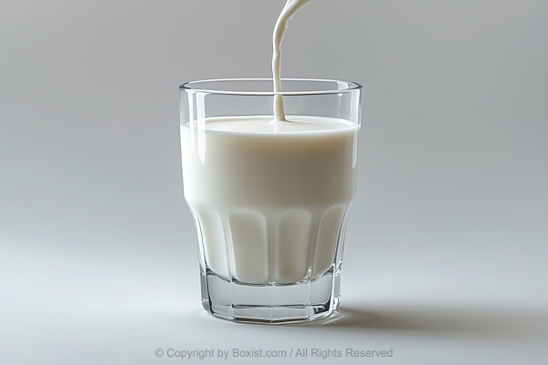 Milk Being Poured Into Glass