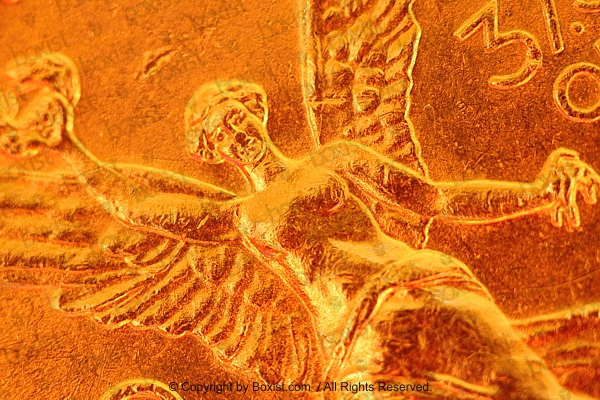 Macro Of Mexican Angel of Independence Engraved On Gold