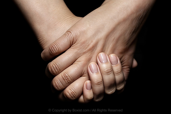 Two Hands Together With Interlaced Fingers