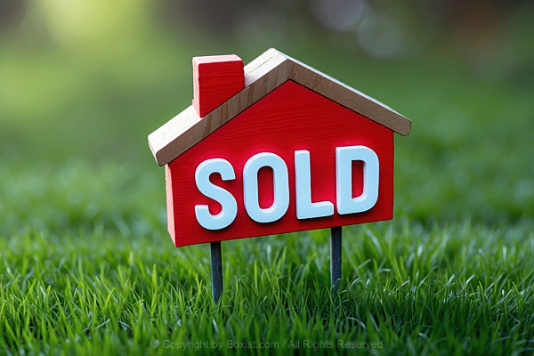Sold On Wooden House Shaped Sign On Green Grass